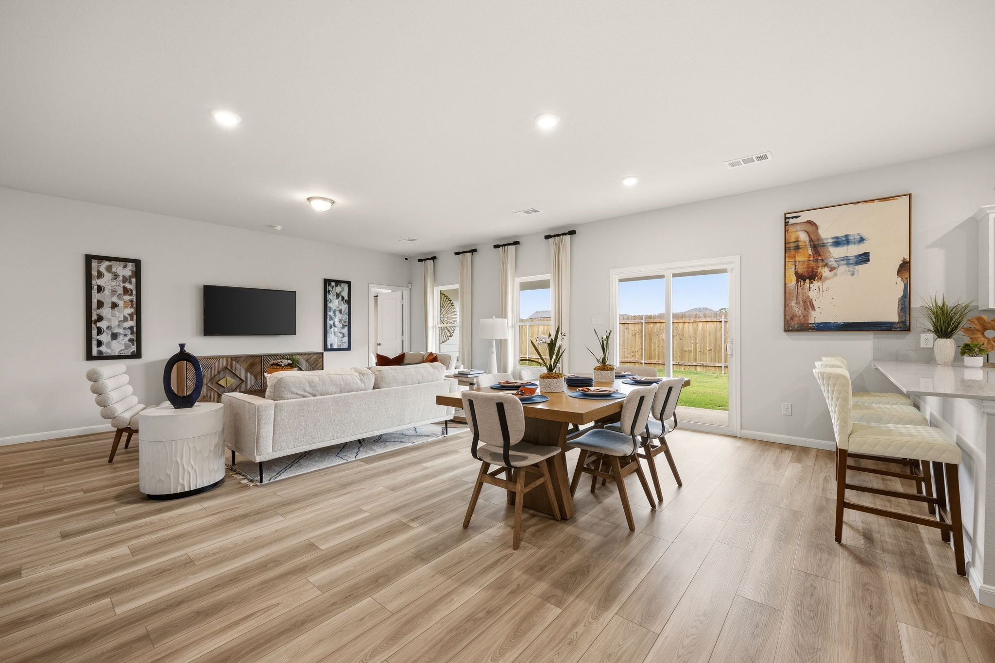 A living room with a wood floor.