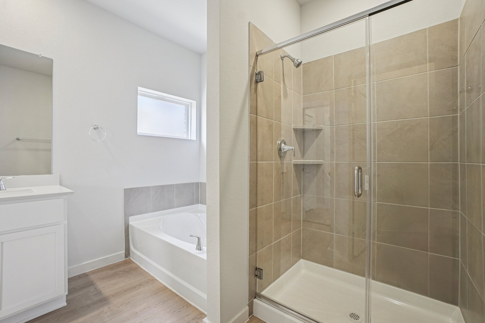 A bathroom with a glass shower.