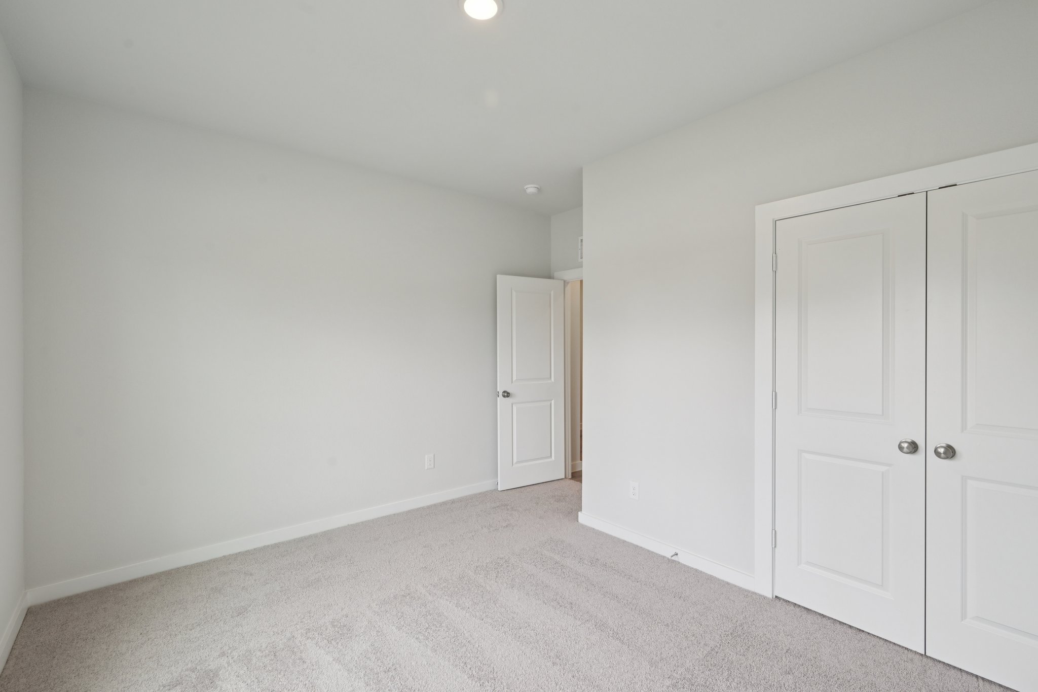 A room with white doors.