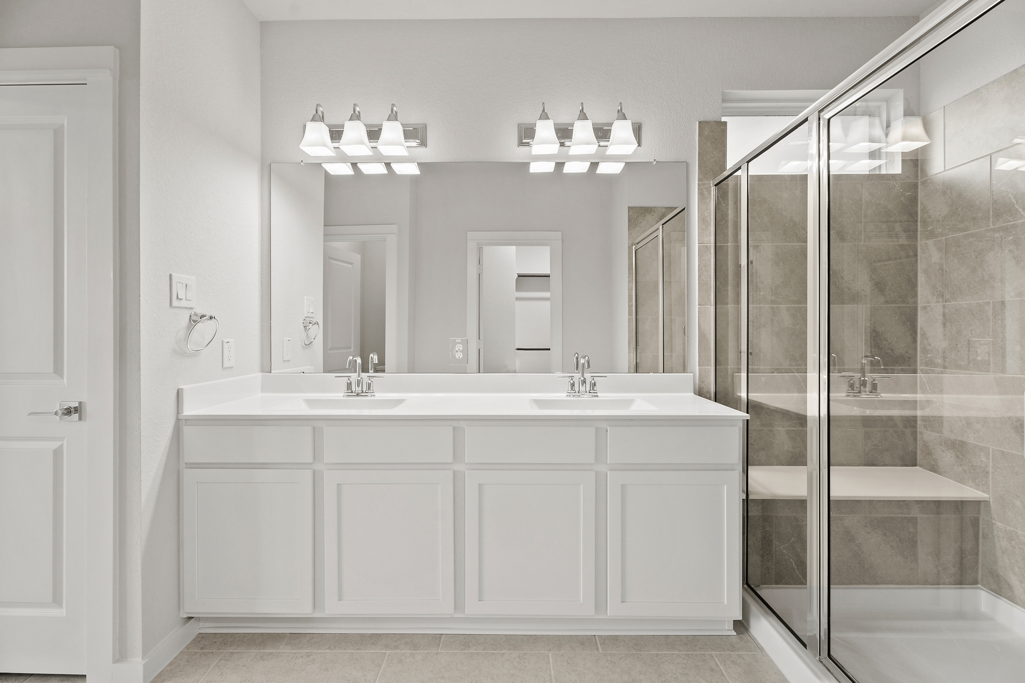 A bathroom with a glass shower.