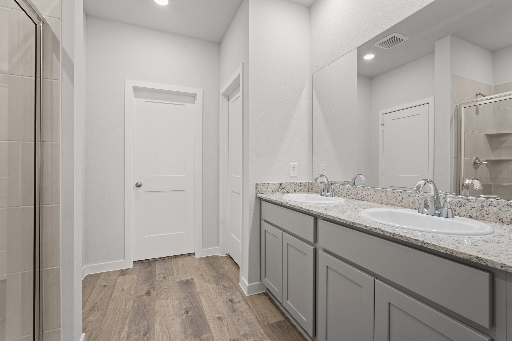 A bathroom with a marble countertop.