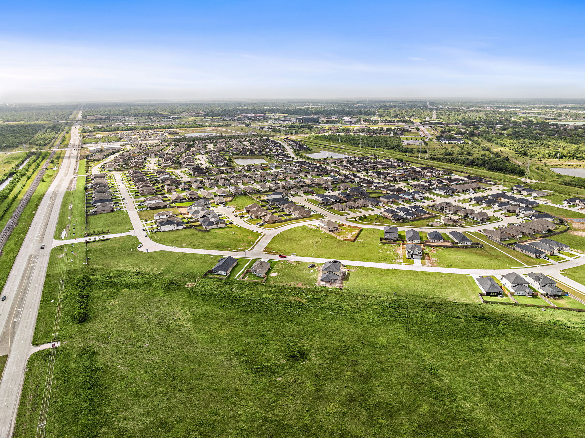 A landscape with buildings and grass.