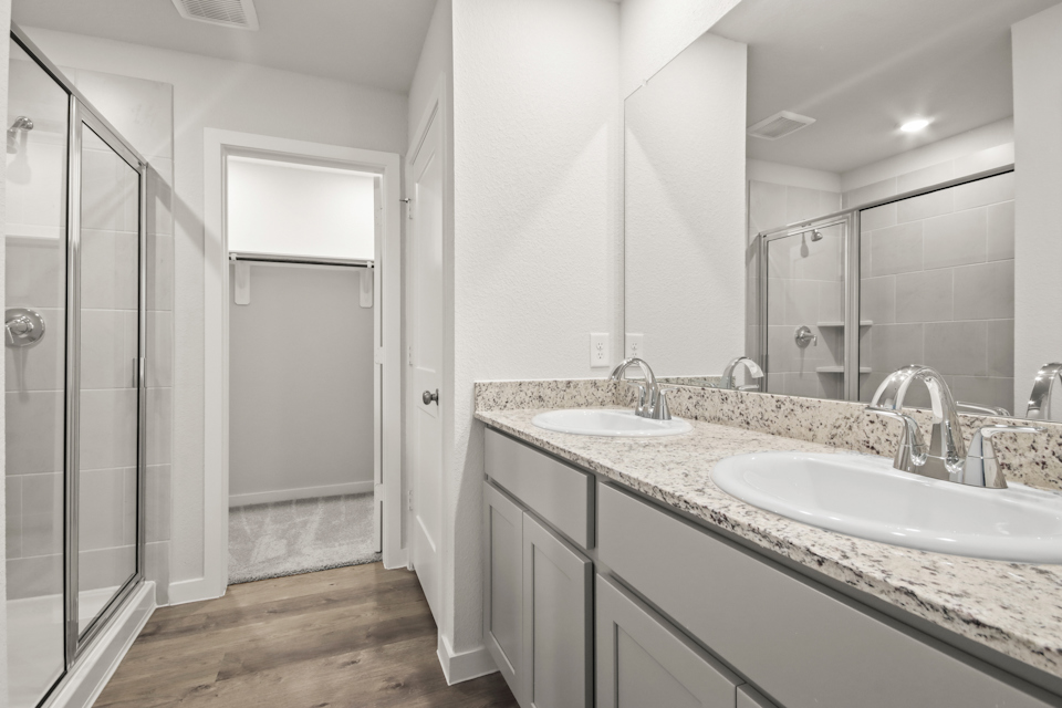 A bathroom with a glass shower.