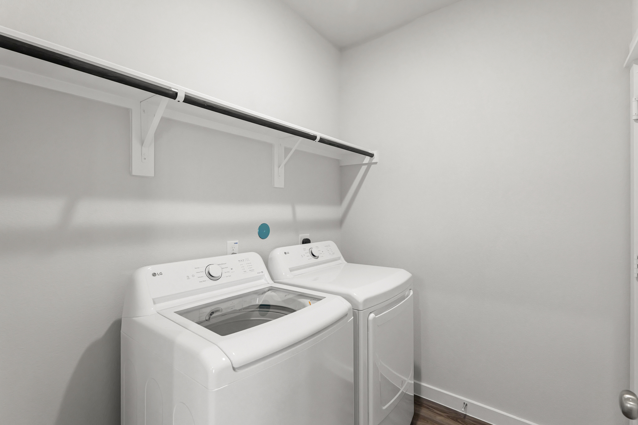 A washing machine in a room.