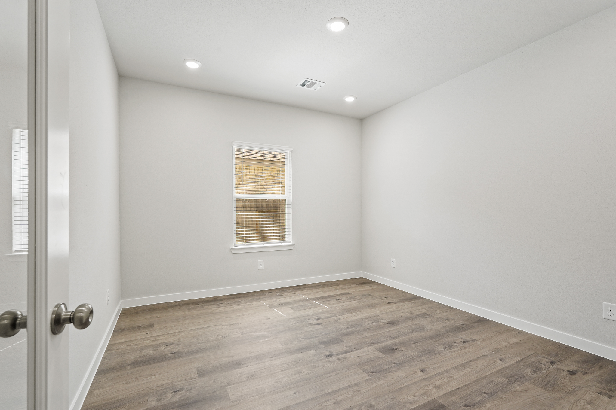 A room with a wood floor and a wood floor.