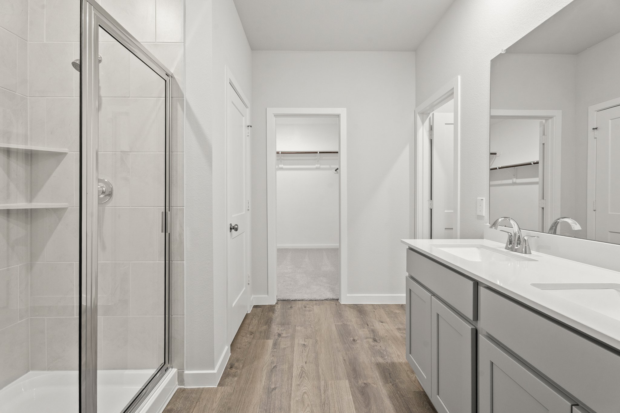 A bathroom with a glass shower.