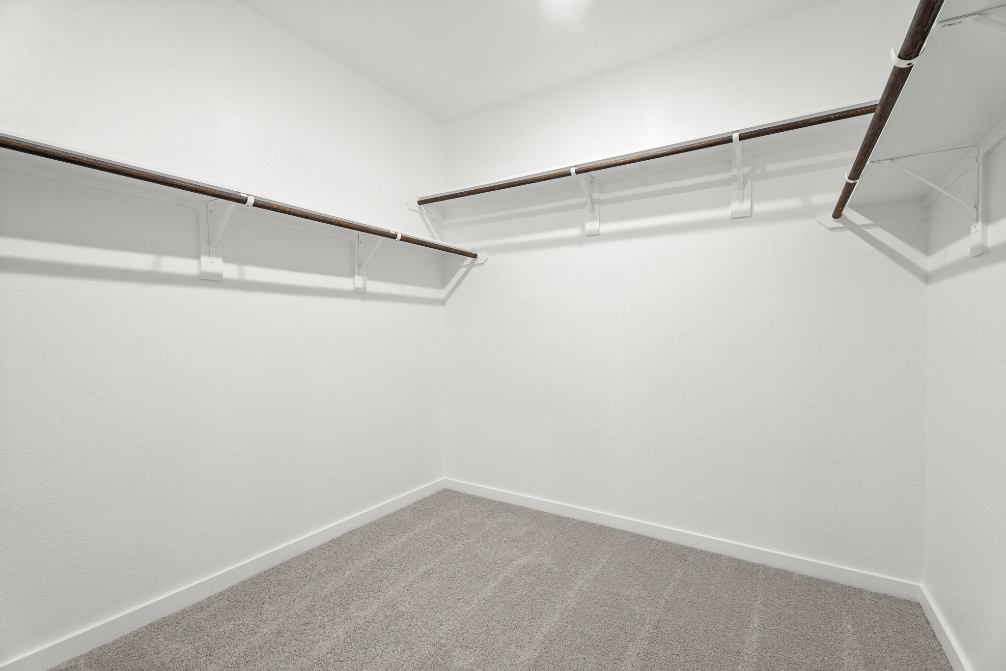 A white room with a staircase.