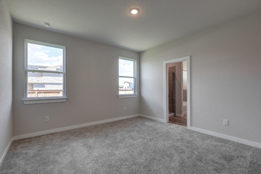 A room with a window and a door.