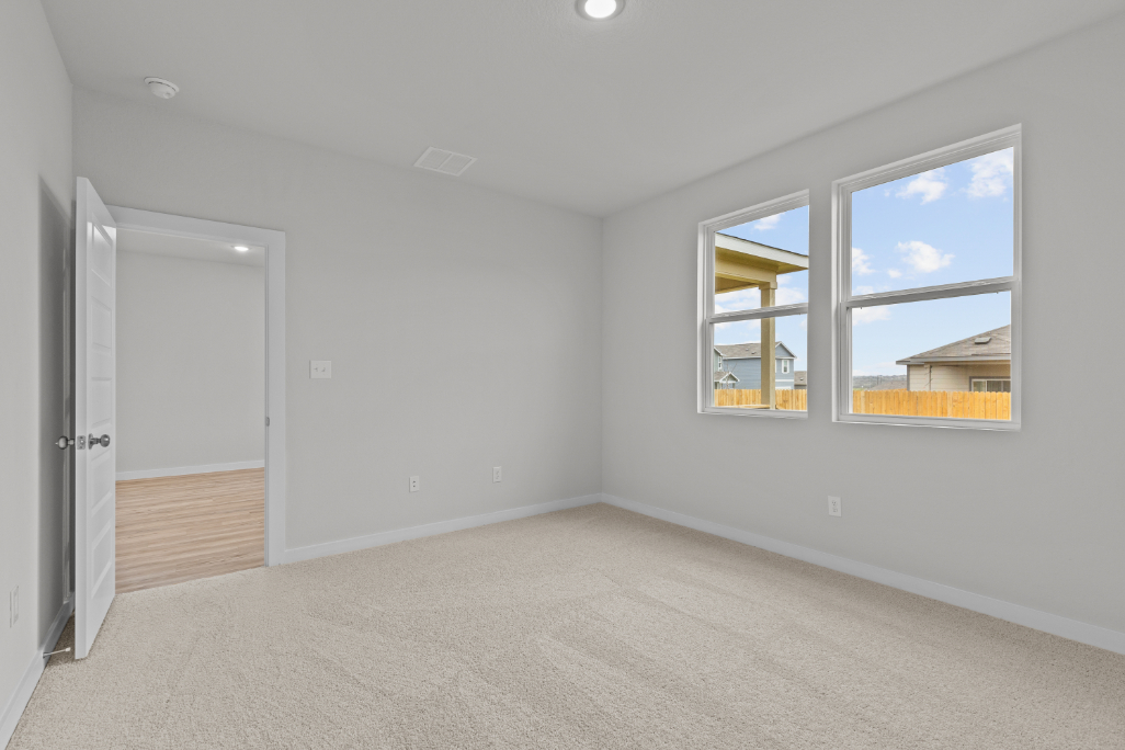 A room with a door and windows.