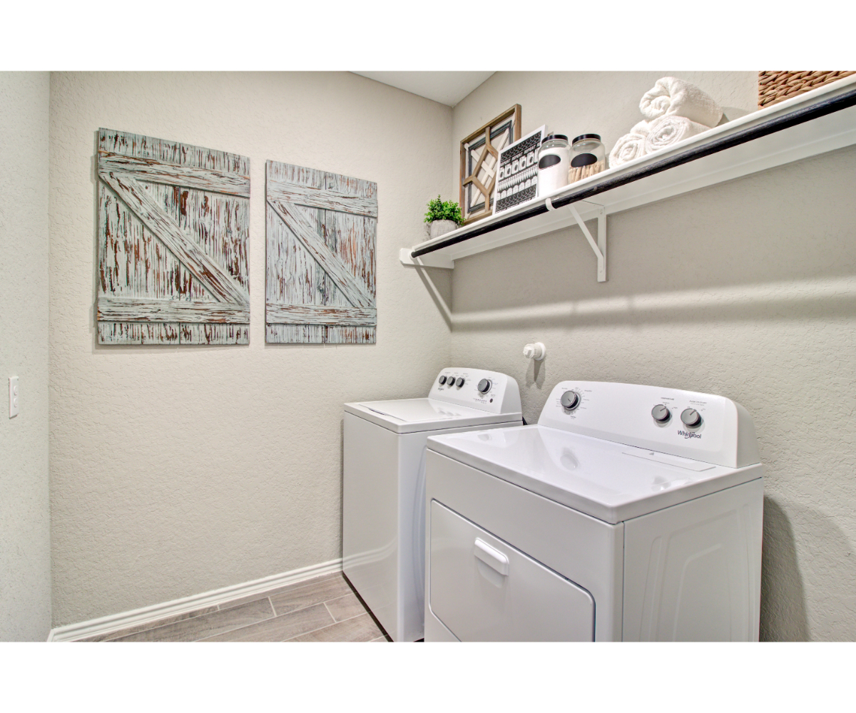 A white washer and dryer in a room.