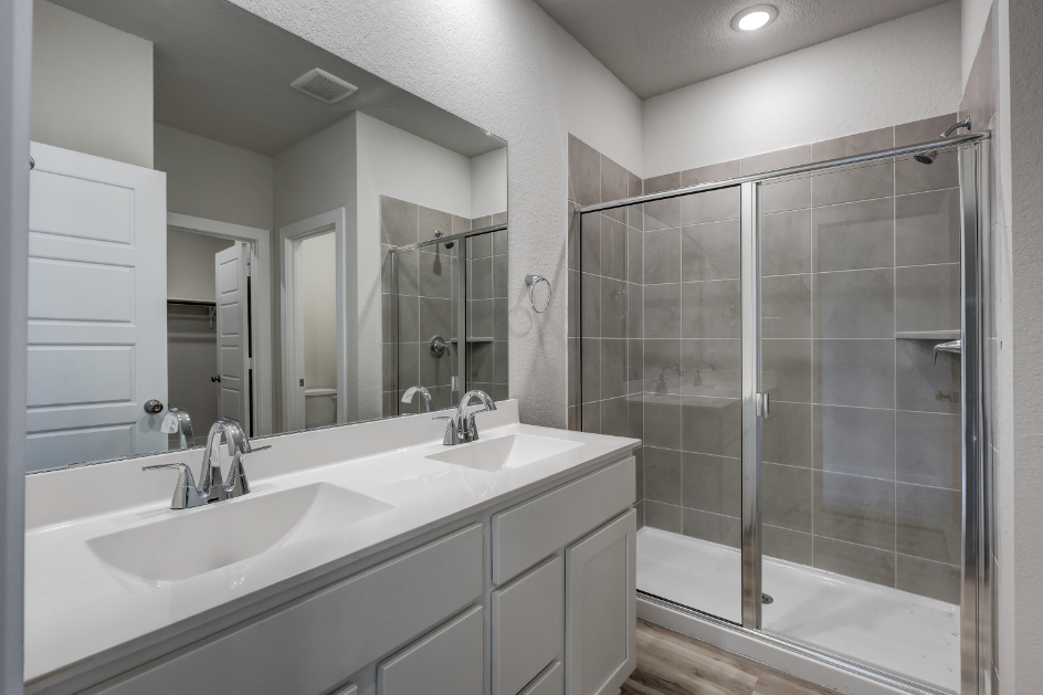A bathroom with a glass shower.