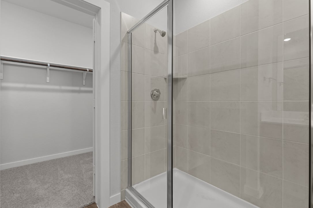 A shower with a glass door.