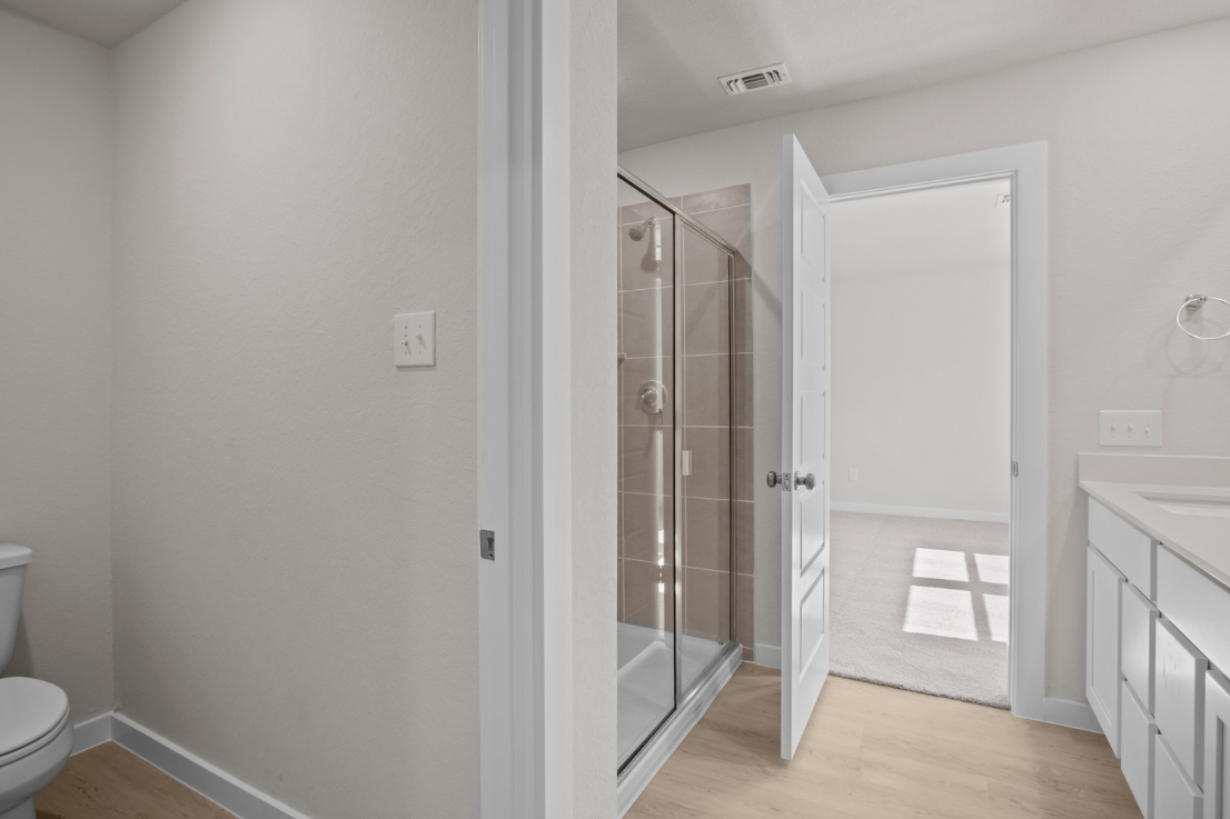 A bathroom with a glass shower.