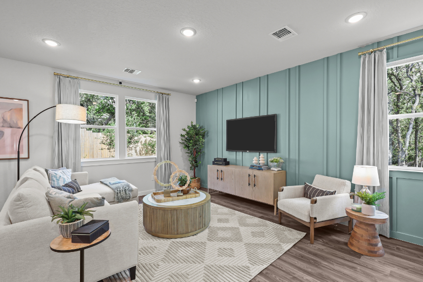 A living room with a tv and couches.