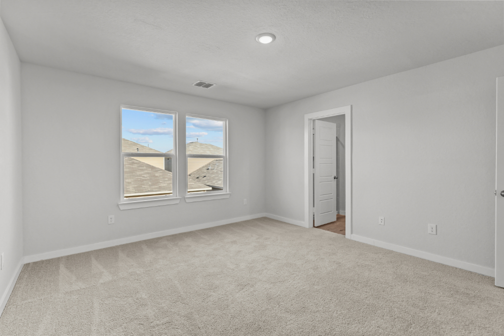 A room with a window and a door.