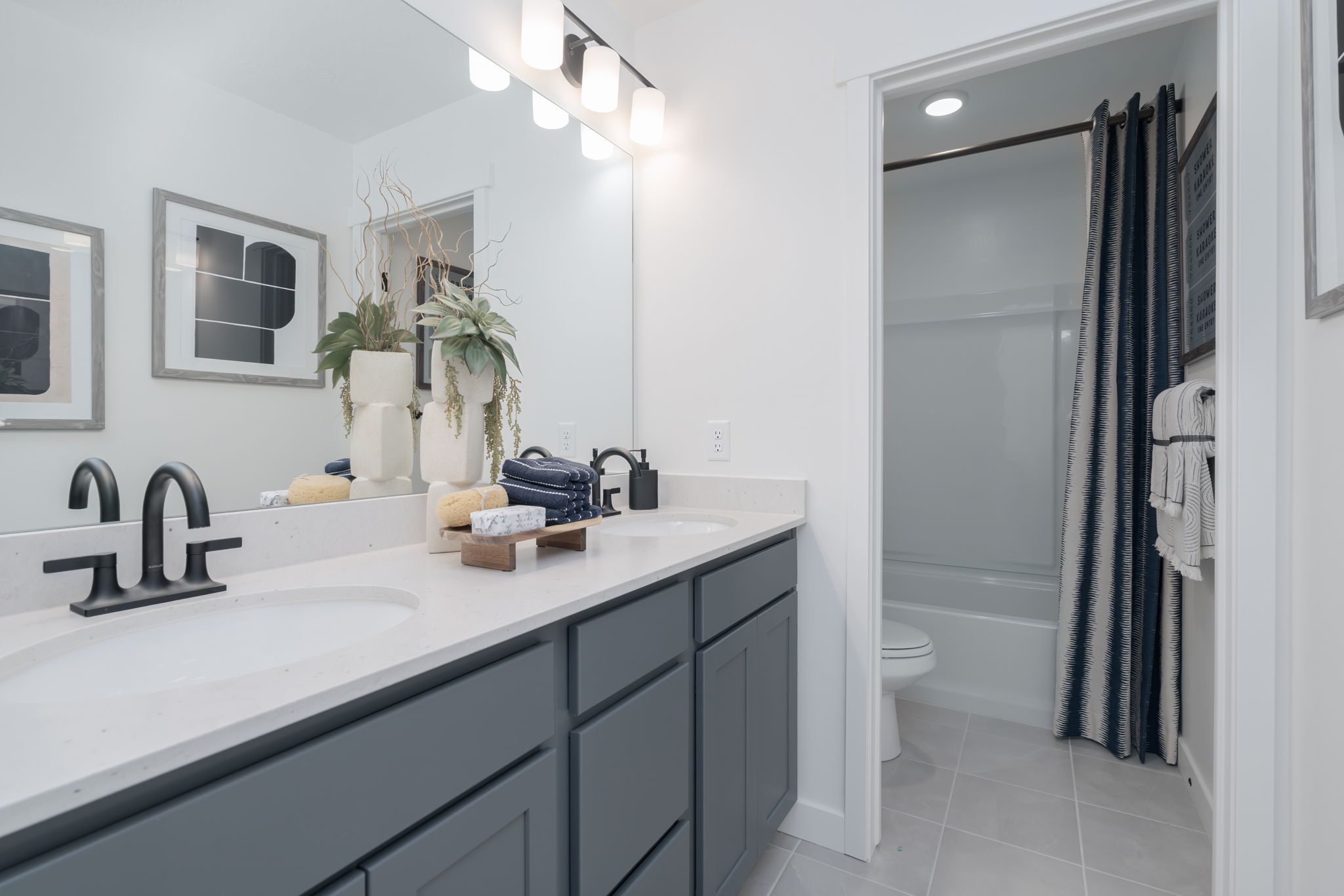 A bathroom with a sink and a shower.