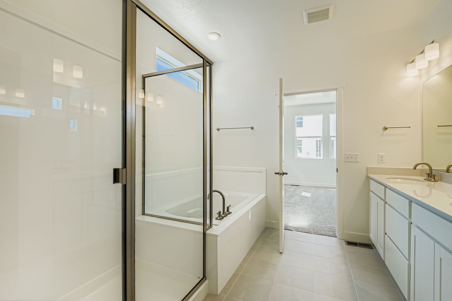 A bathroom with a glass shower.