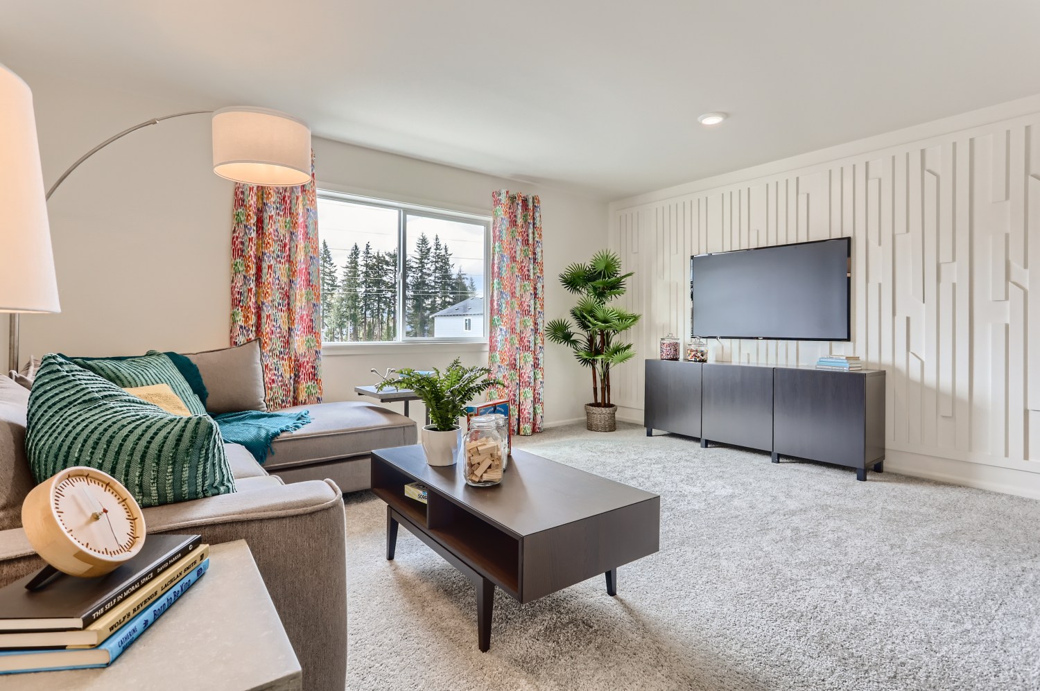 A living room with a tv and couches.