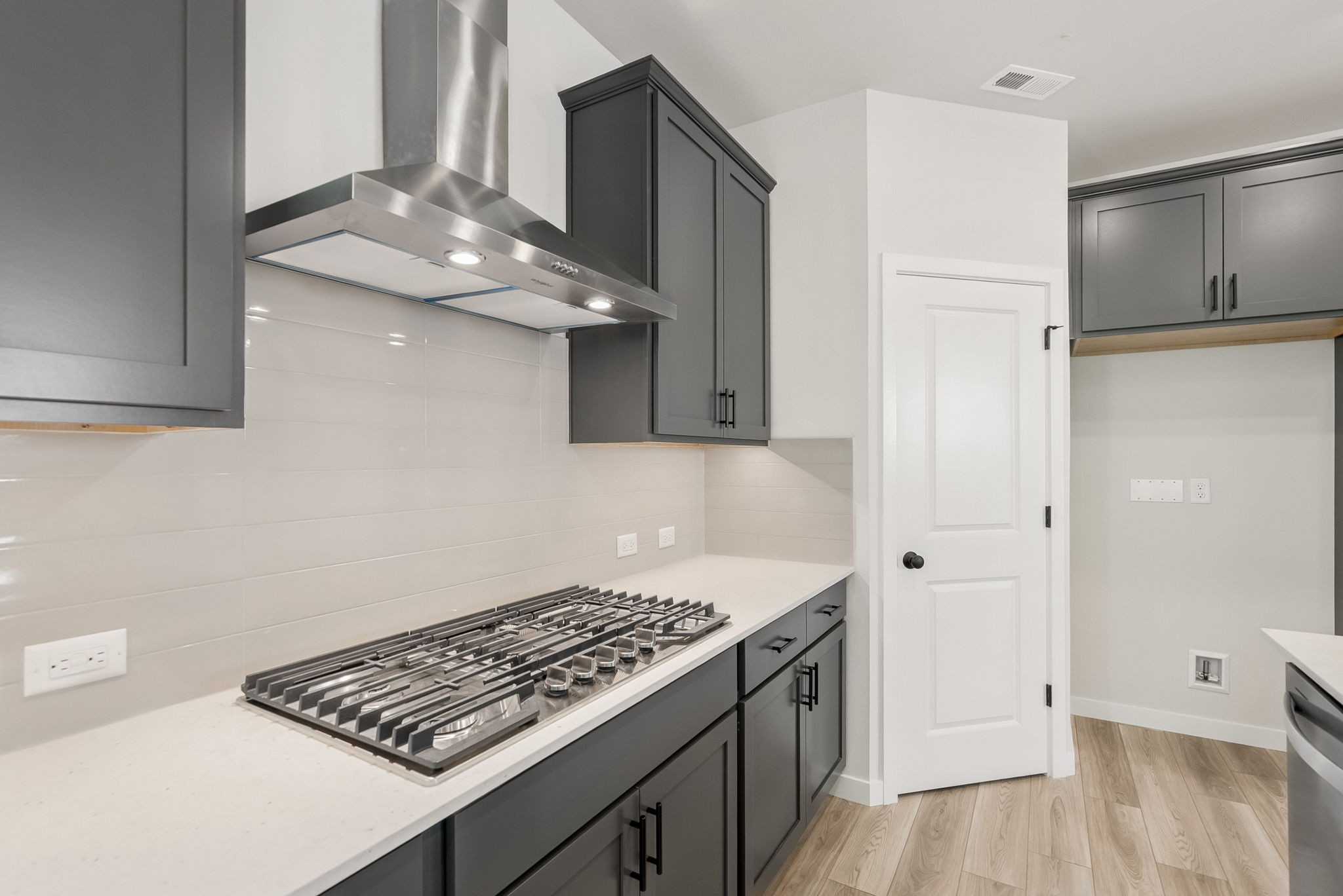 A kitchen with a stove and oven.