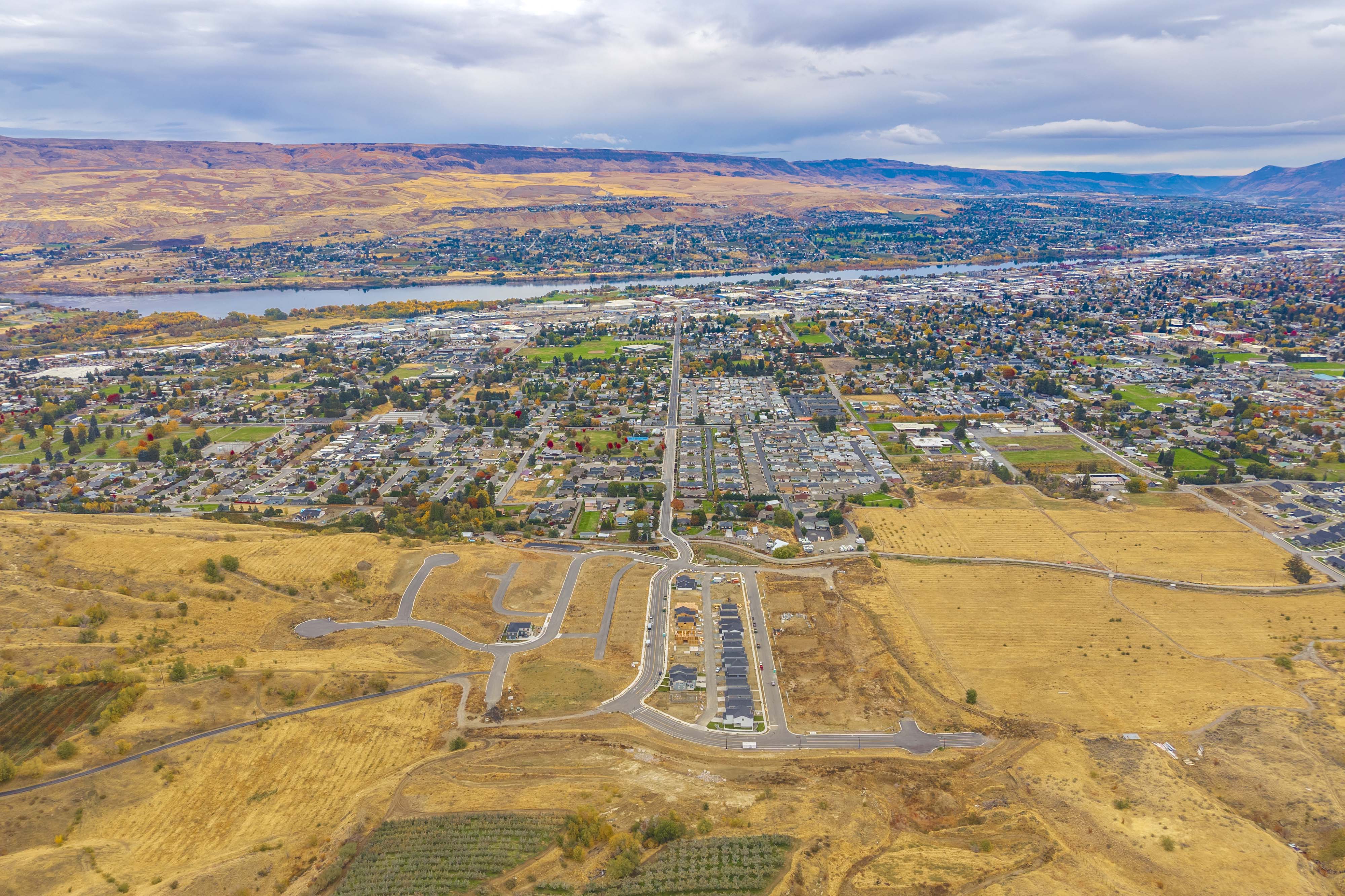 A landscape with a road and fields.