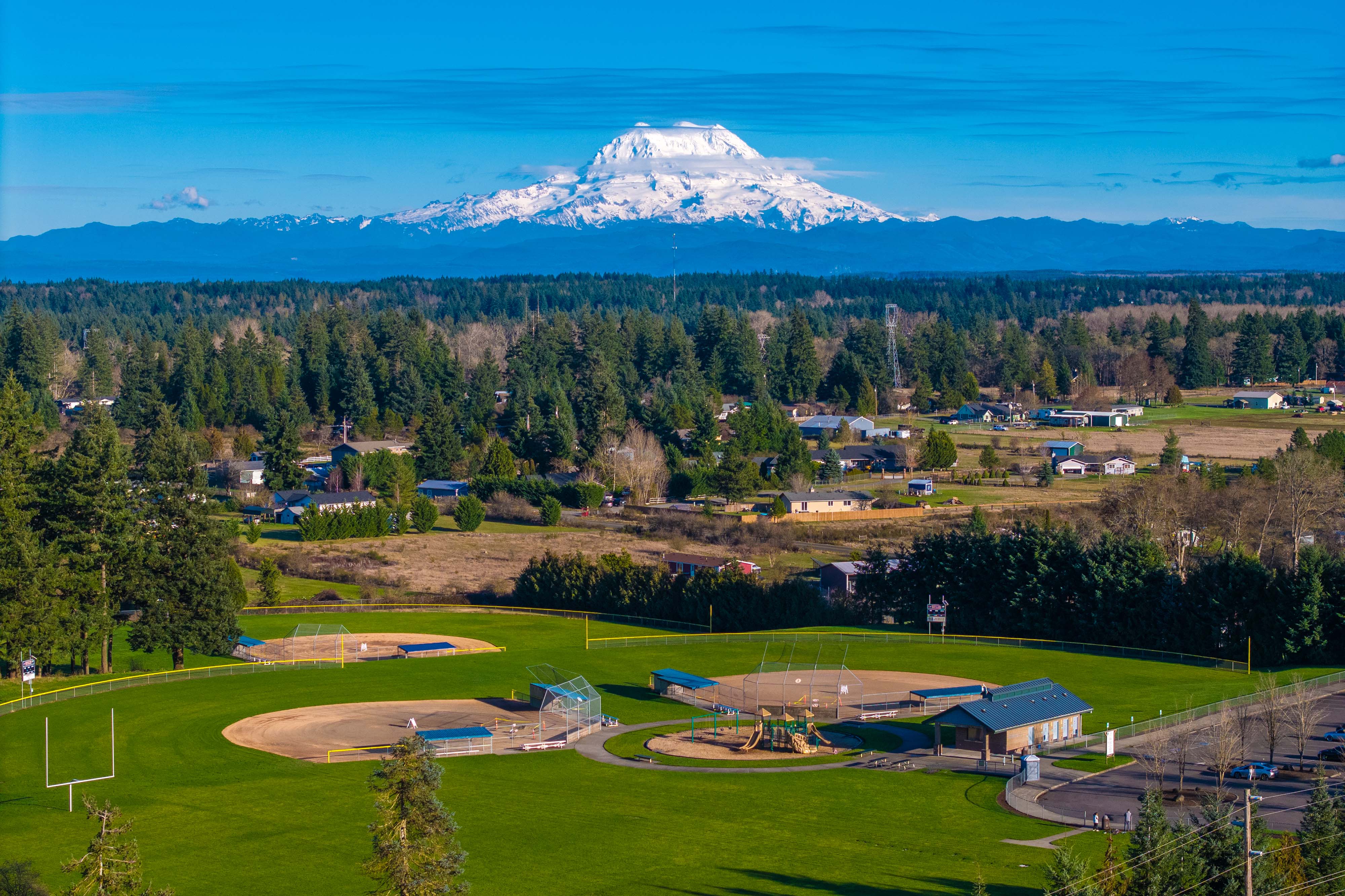 A golf course with a mountain in the background.