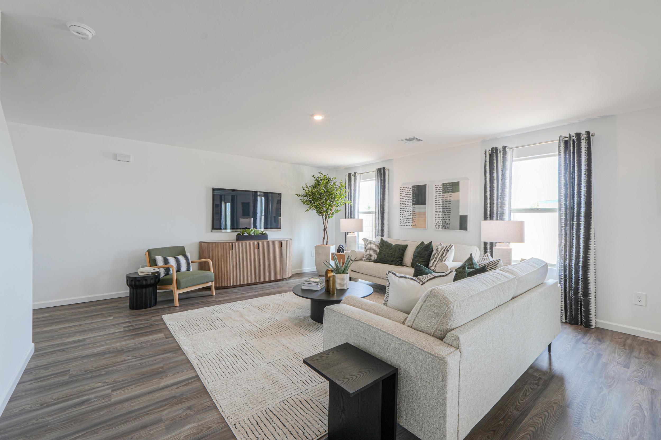 A living room with a couch and a table.