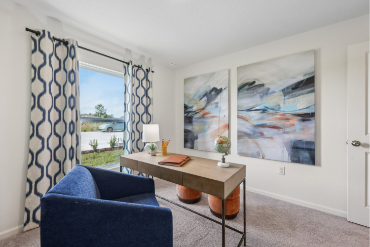 A room with a table and chairs.