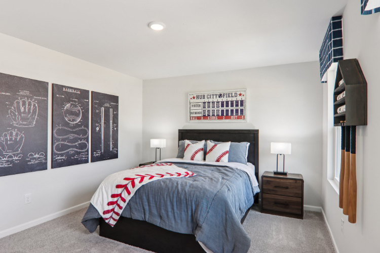 A bedroom with a bed and a tv.