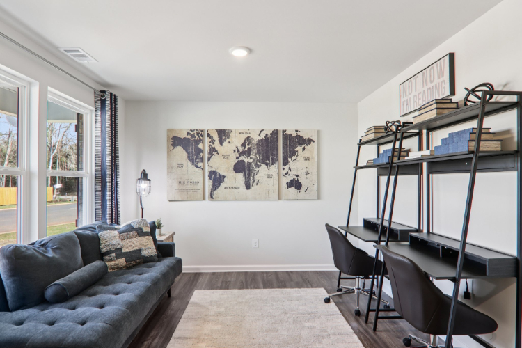 A living room with a couch and a table.