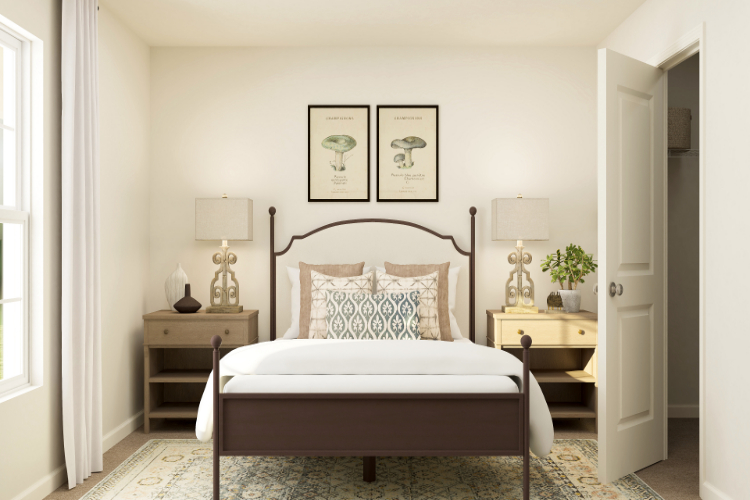 A bed with a white bed spread.