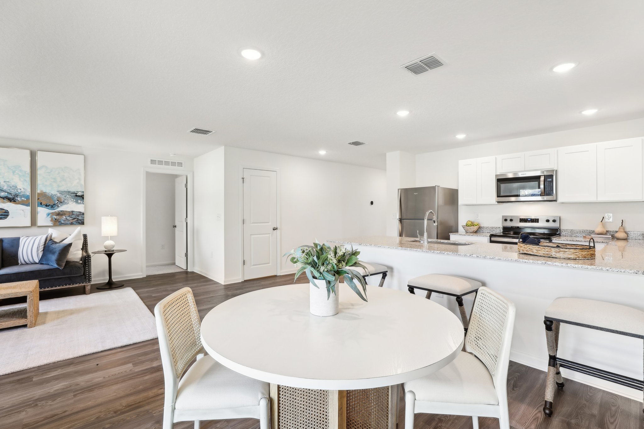 A kitchen with a dining table.