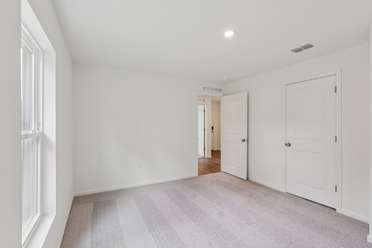 A hallway with white doors.