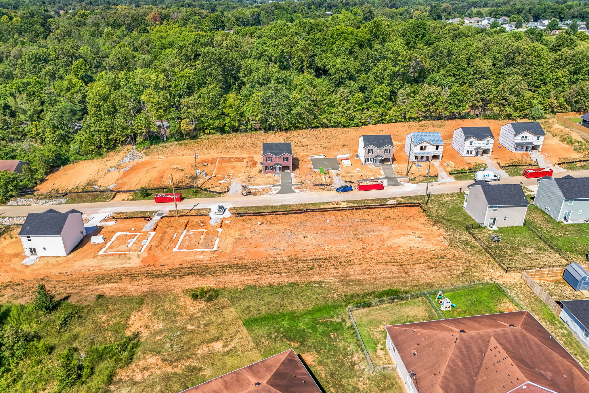 A group of houses and trees.