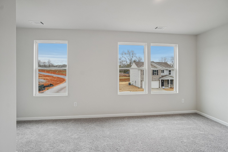 A room with a couple of paintings on the wall.