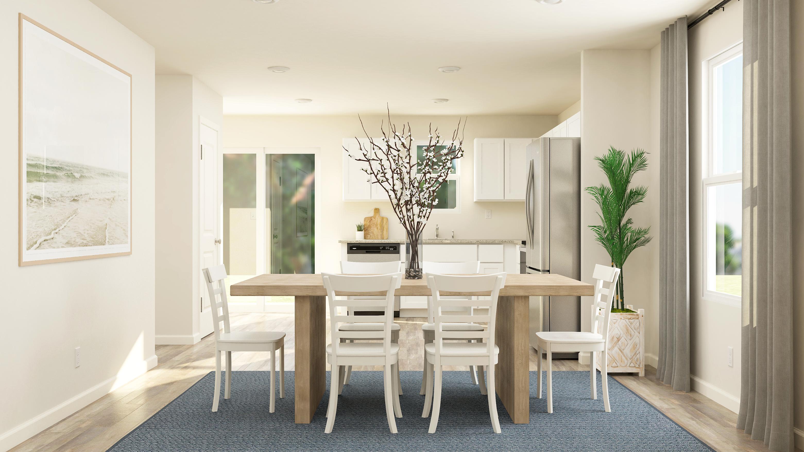 A dining room with a table and chairs.