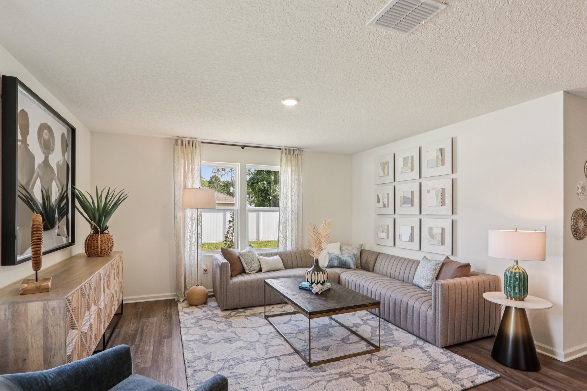 A living room with a couch and a coffee table.